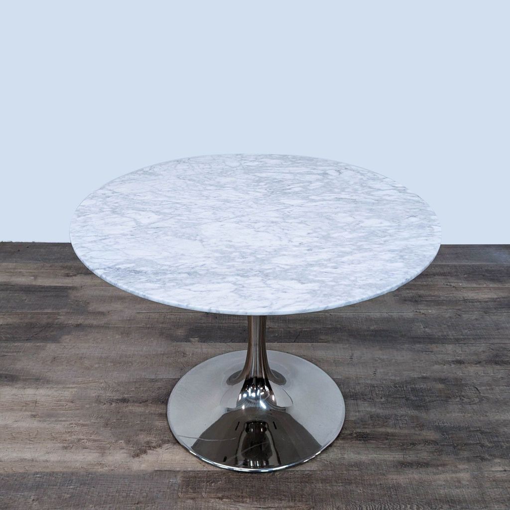 a marble table with a chrome base