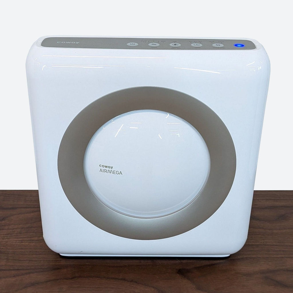 a white air purifier on a wooden table.