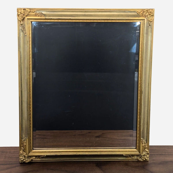 a large antique french gold framed mirror