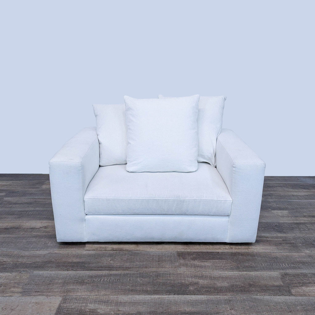 all white modern chair with pillow