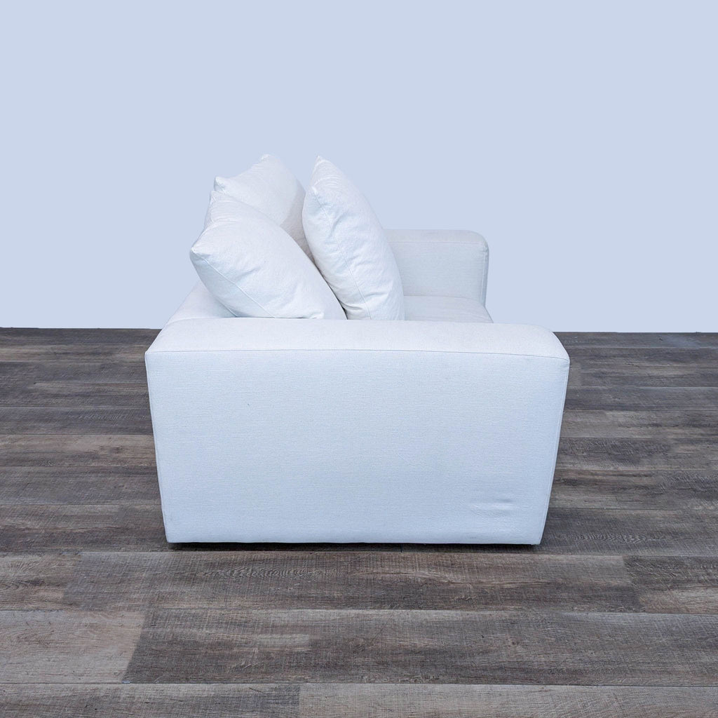 all white leather sofa with pillows