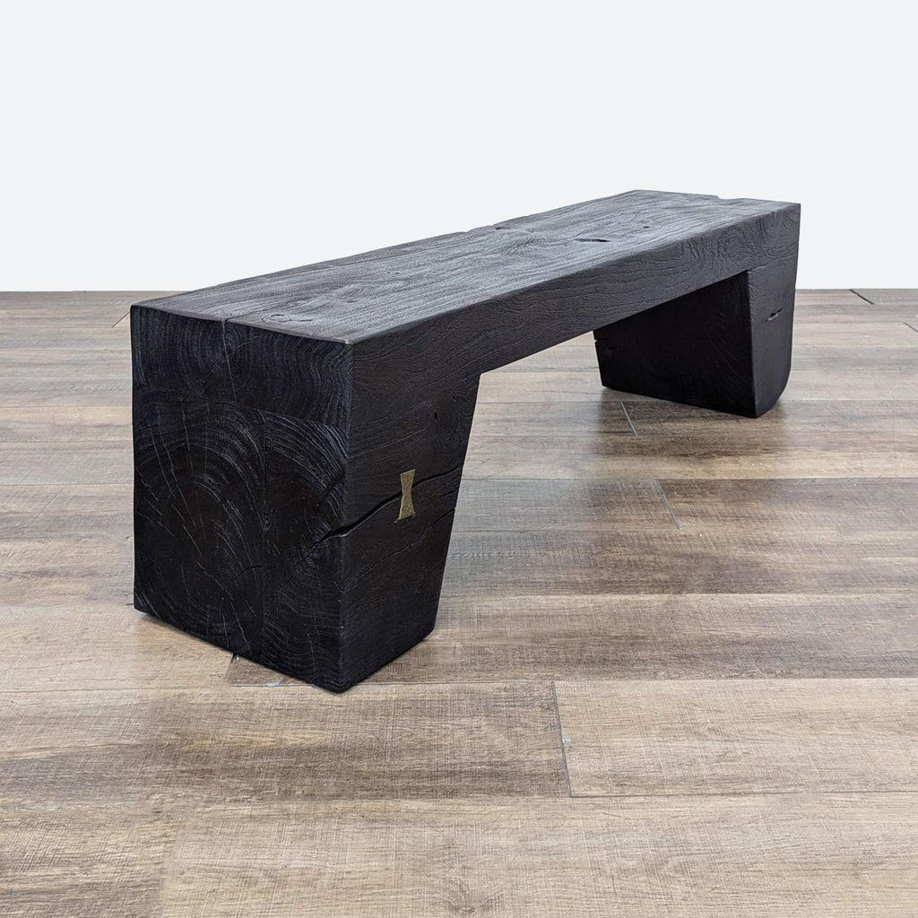 a black wood bench with a metal base.