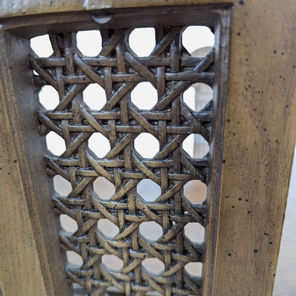 a close up of a wooden chair with a lattice design.