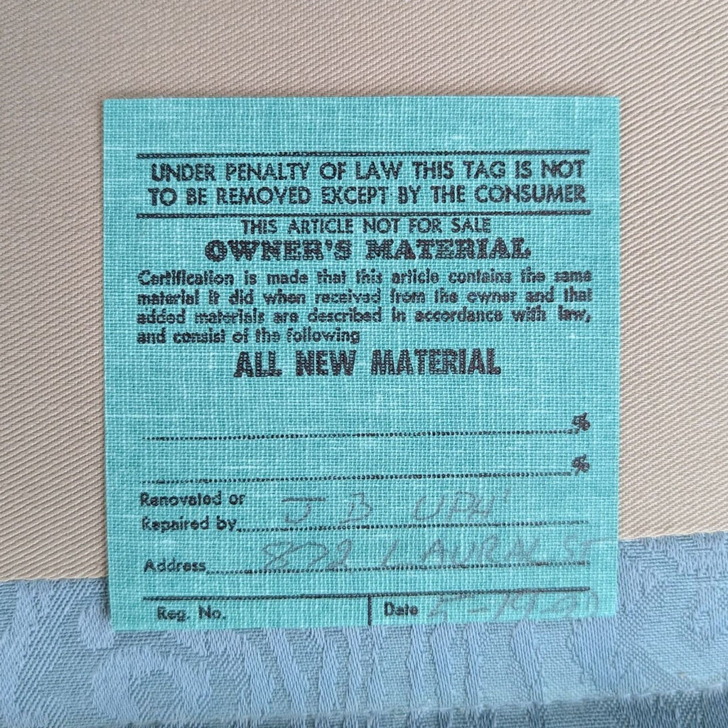 a blue card with the words ` ` penalty of law'' in the bottom.