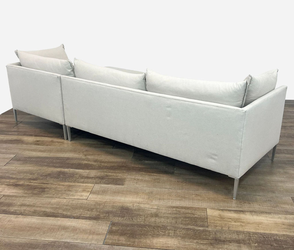 sofa by [ unused0 ], circa 1970s. the sofa is made of a soft grey velvet