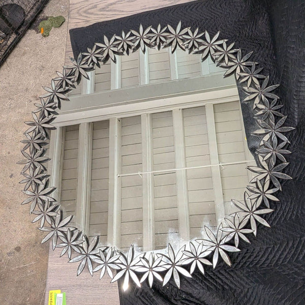 a mirror with a star pattern