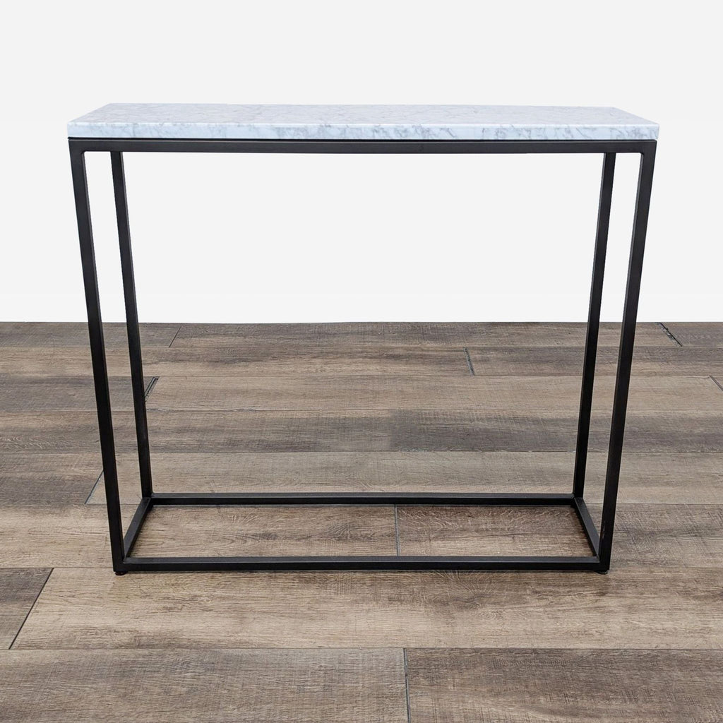 the marble top side table is a modern, minimalist design.