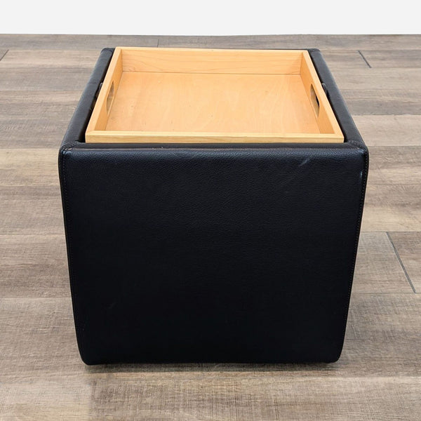 a black square coffee table with a square base and a square base.