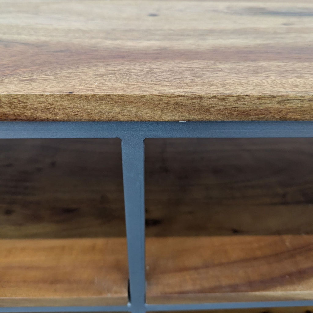 the metal frame of the shelf is made of a thick piece of wood.