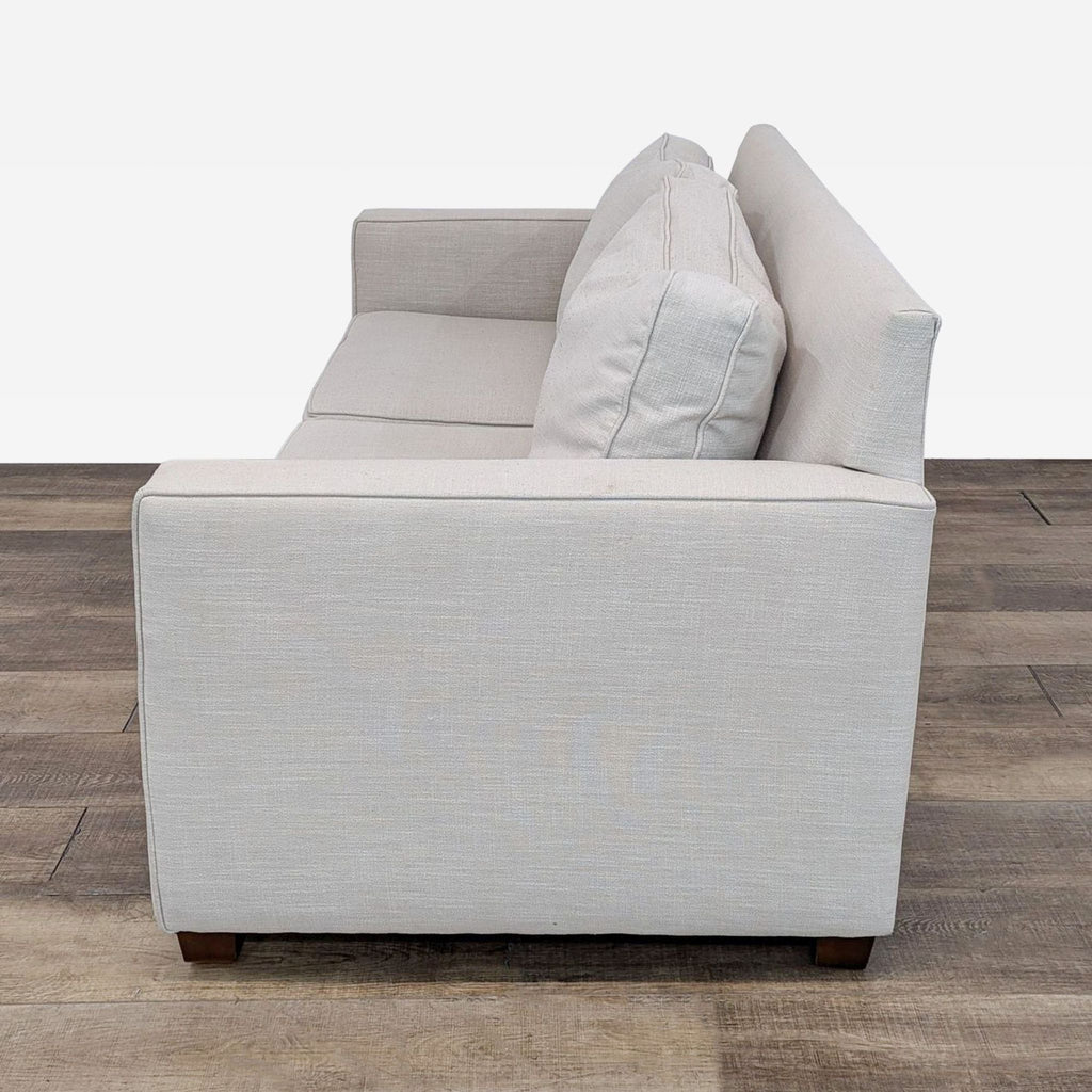 Beige Loveseat with Cushioned Seating and Wooden Legs