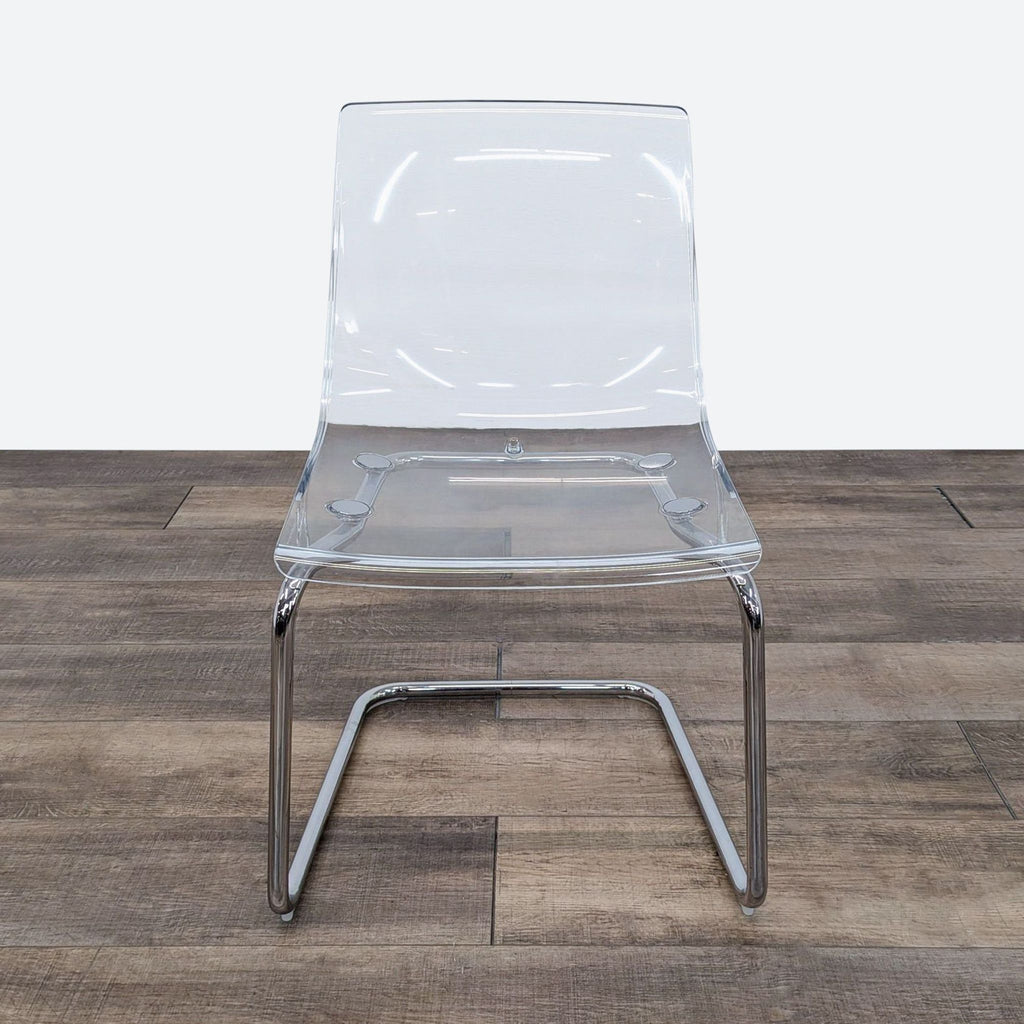 a chair with a clear plastic frame.