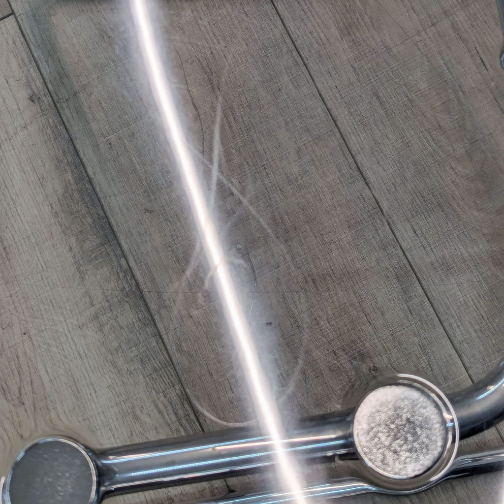 a close up of a metal bar with a light on it