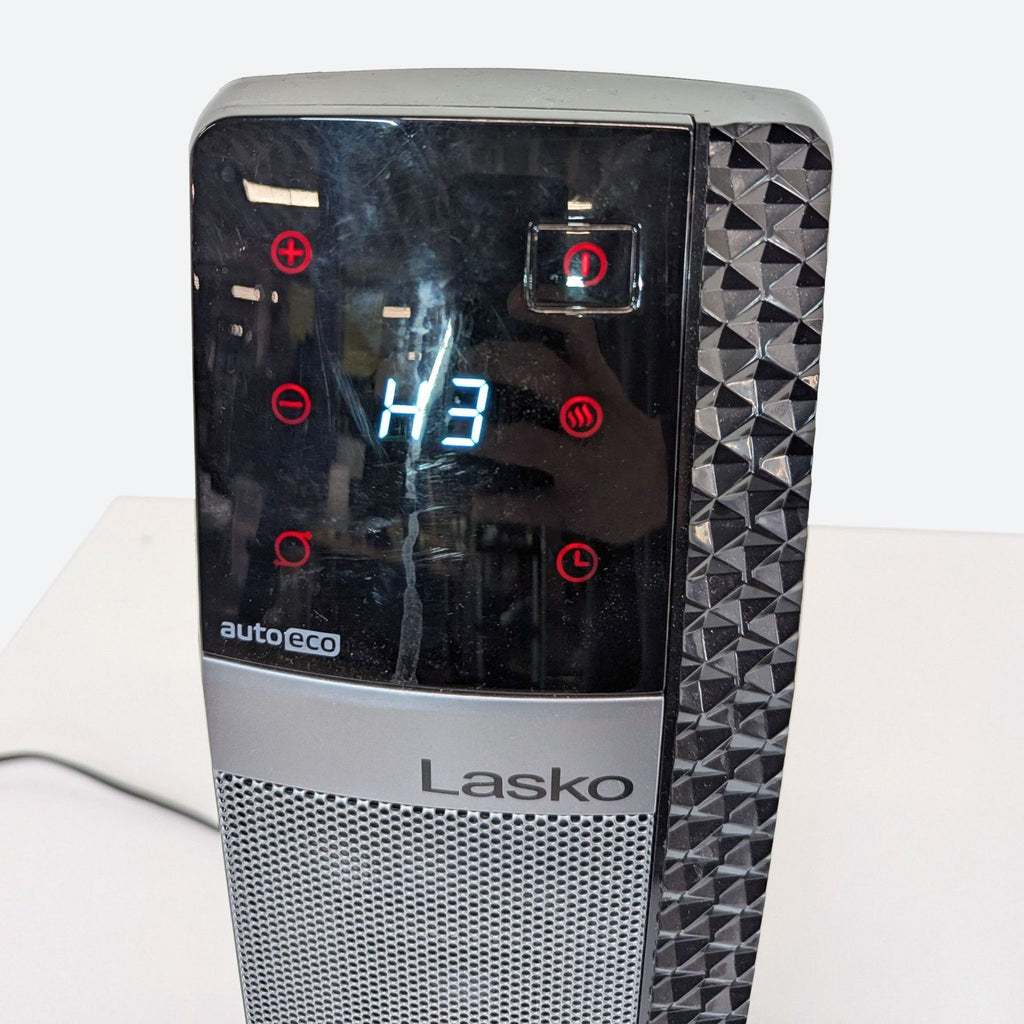 a close up of a laptop with a light on the screen.