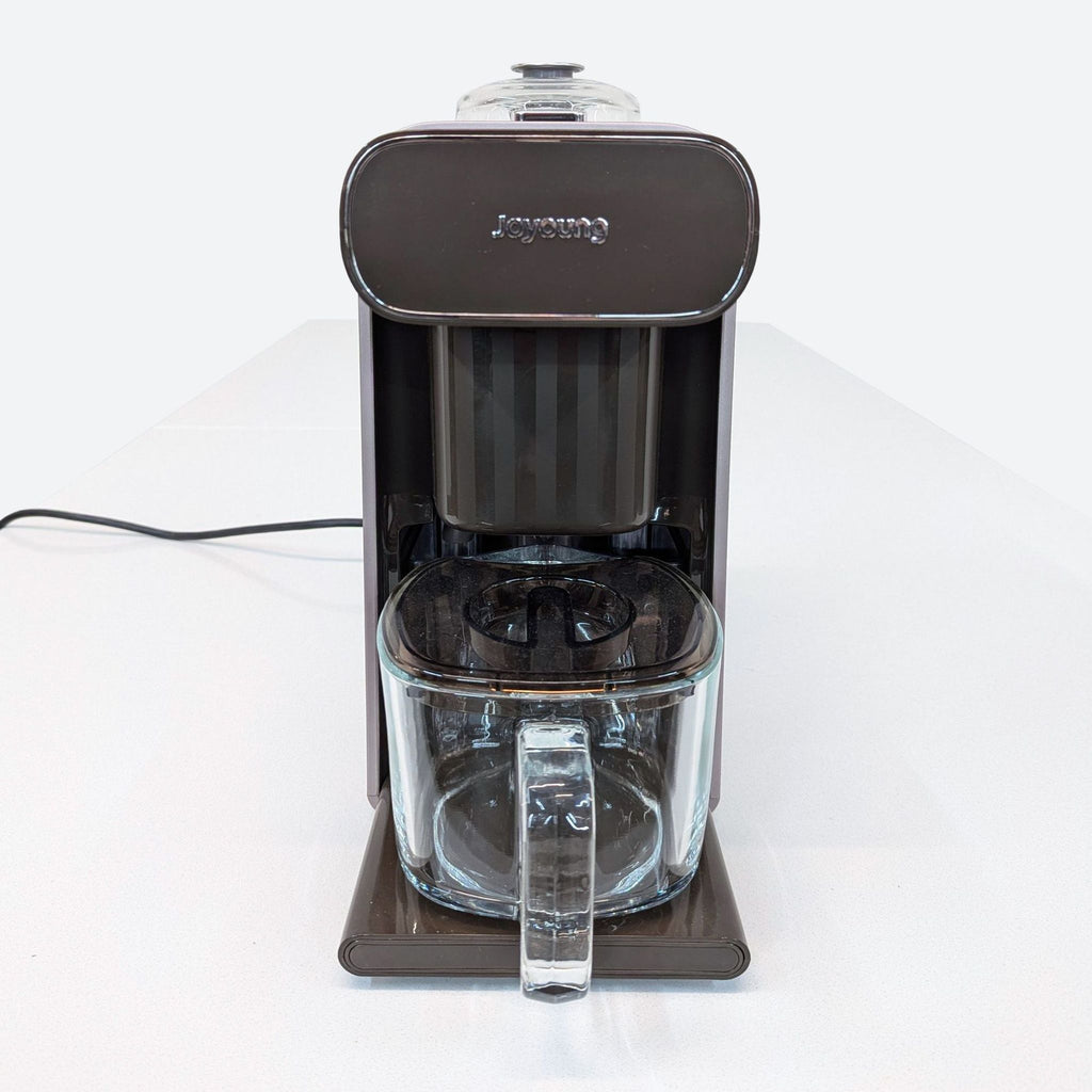 a coffee maker with a wire plugged in