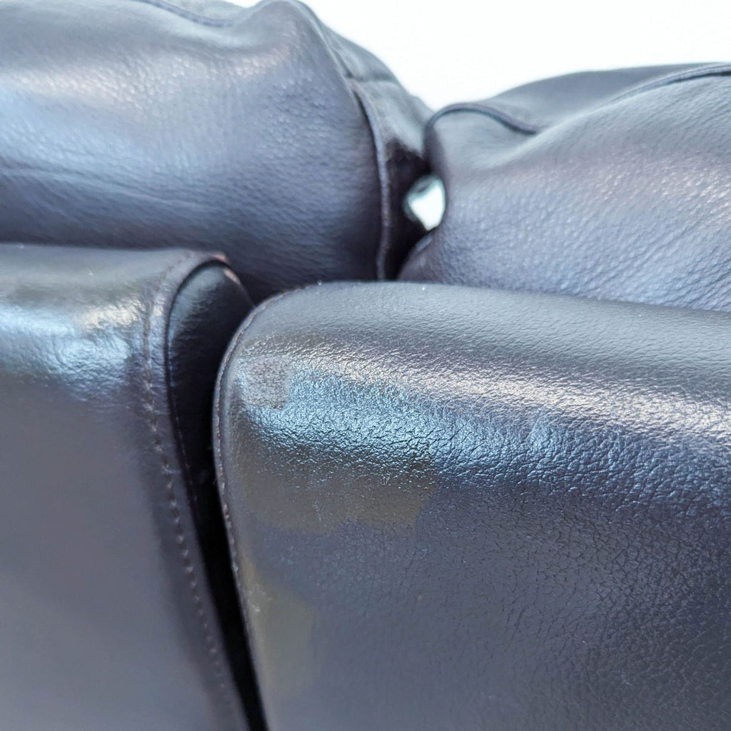 Macy’s Black Leather Reclining Loveseat