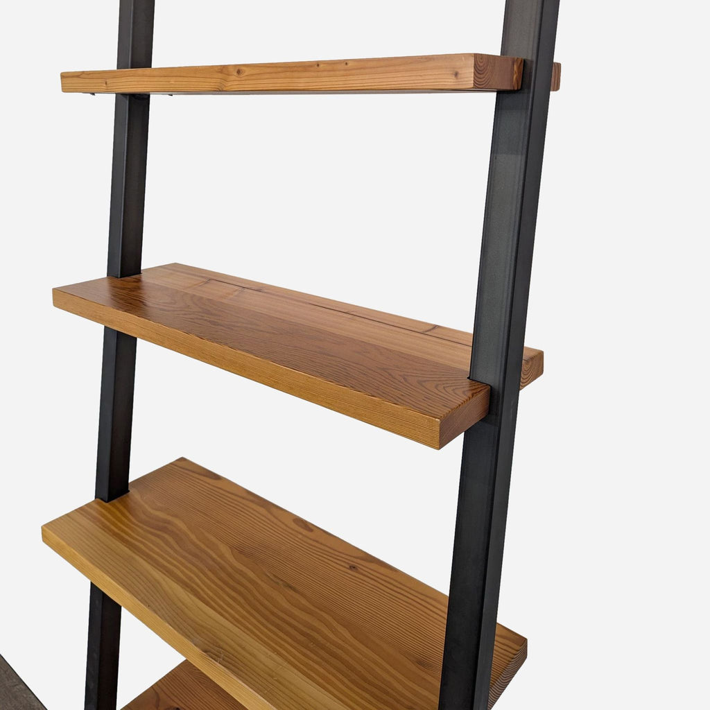 a metal and wood bookcase with a black metal frame and a wooden shelf.