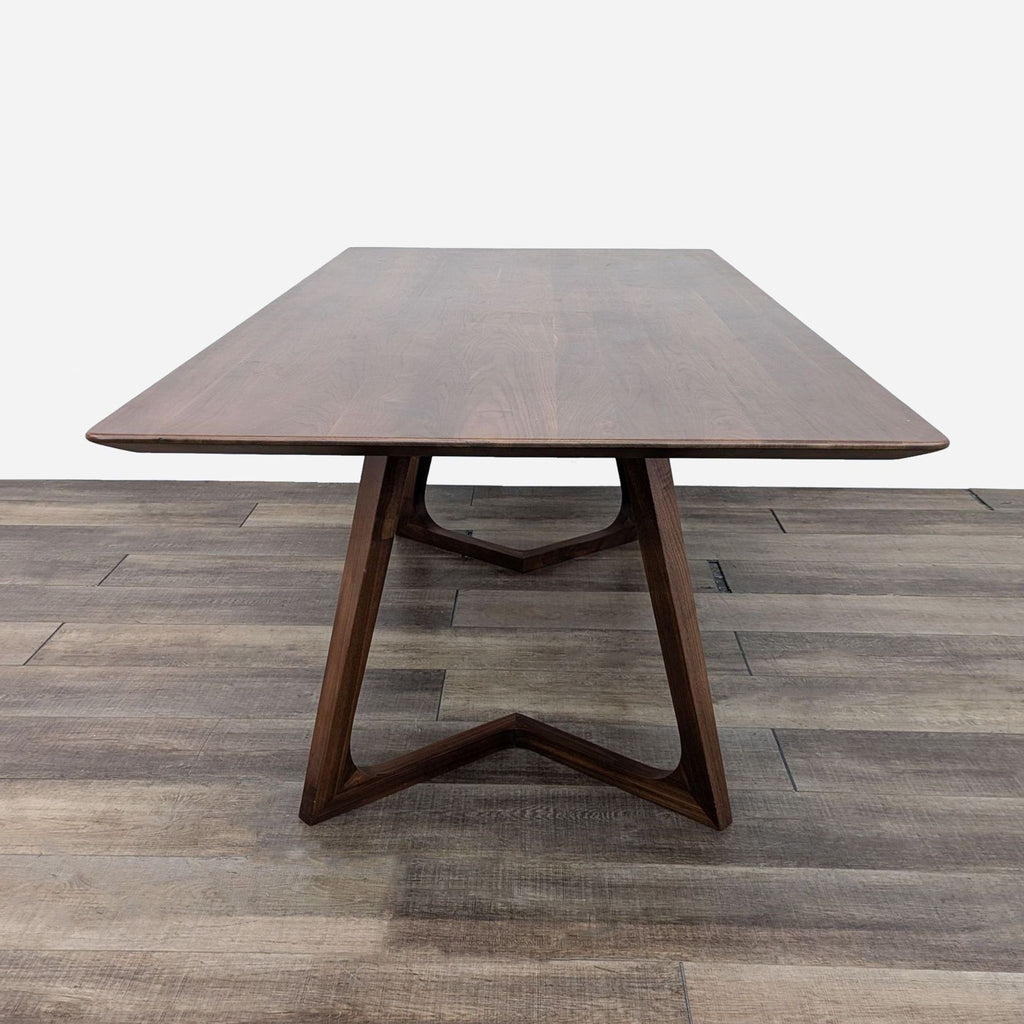 a walnut dining table with a walnut top.