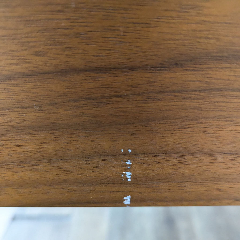 a close up of a wood grained desk top.