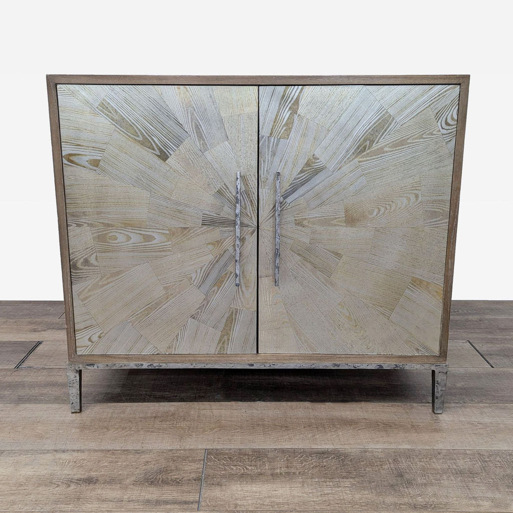 Wood cabinet by Reperch with sunburst pattern doors and metal base.