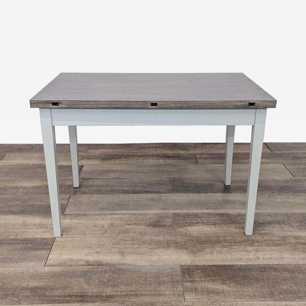 the modern office desk with a gray top and a white metal frame