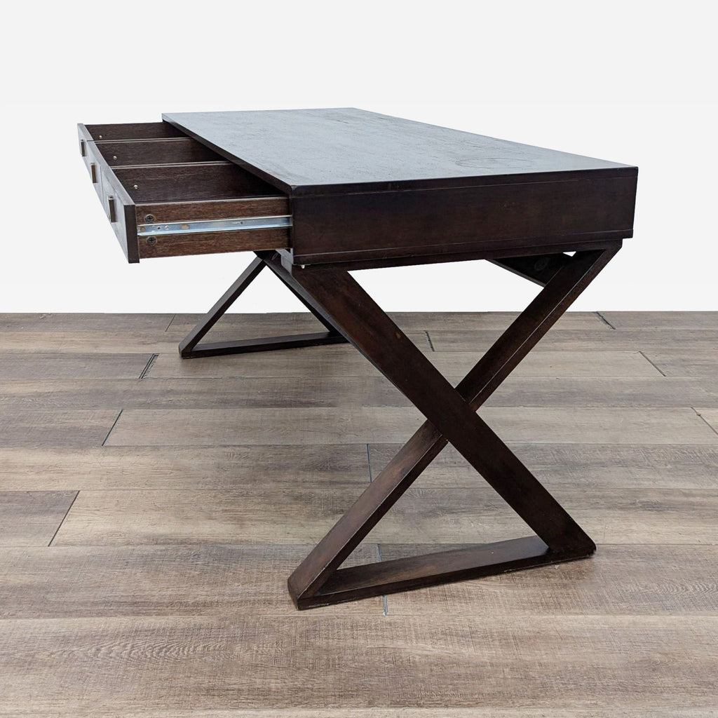 a desk with drawers on a wooden floor.