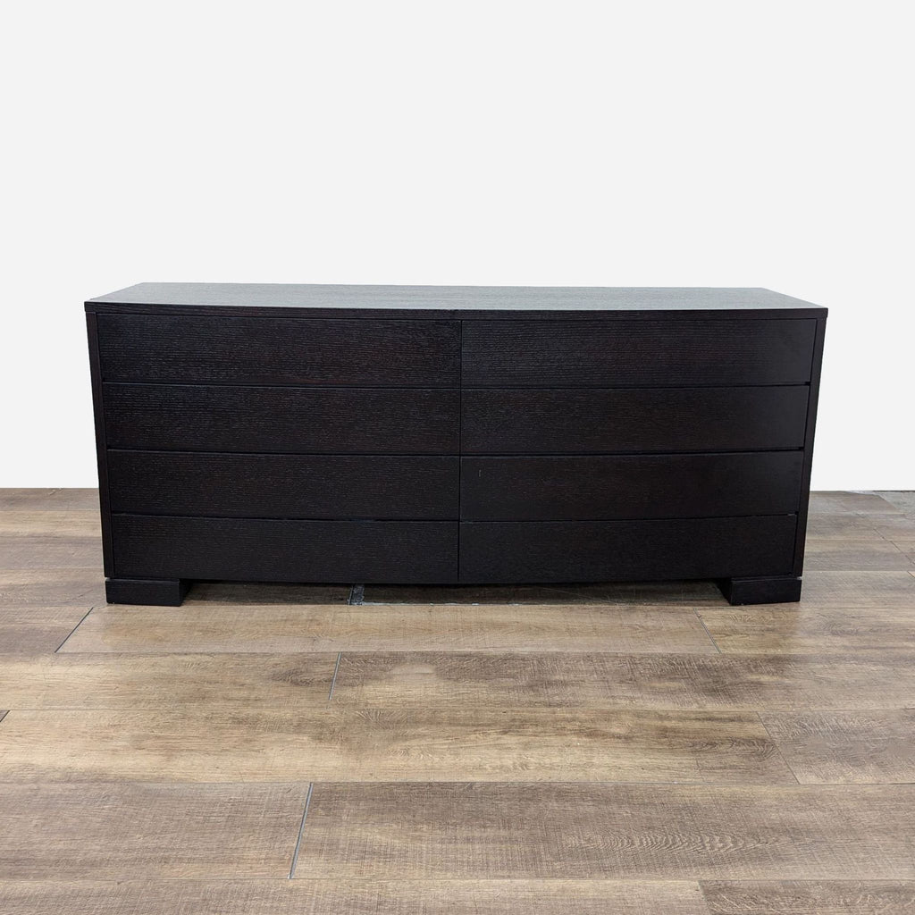 the [ unused0 ] dresser is made of dark wood with a dark finish.