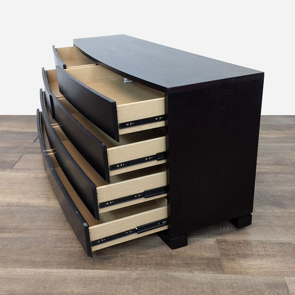 a large, black bookcase with a stack of books.