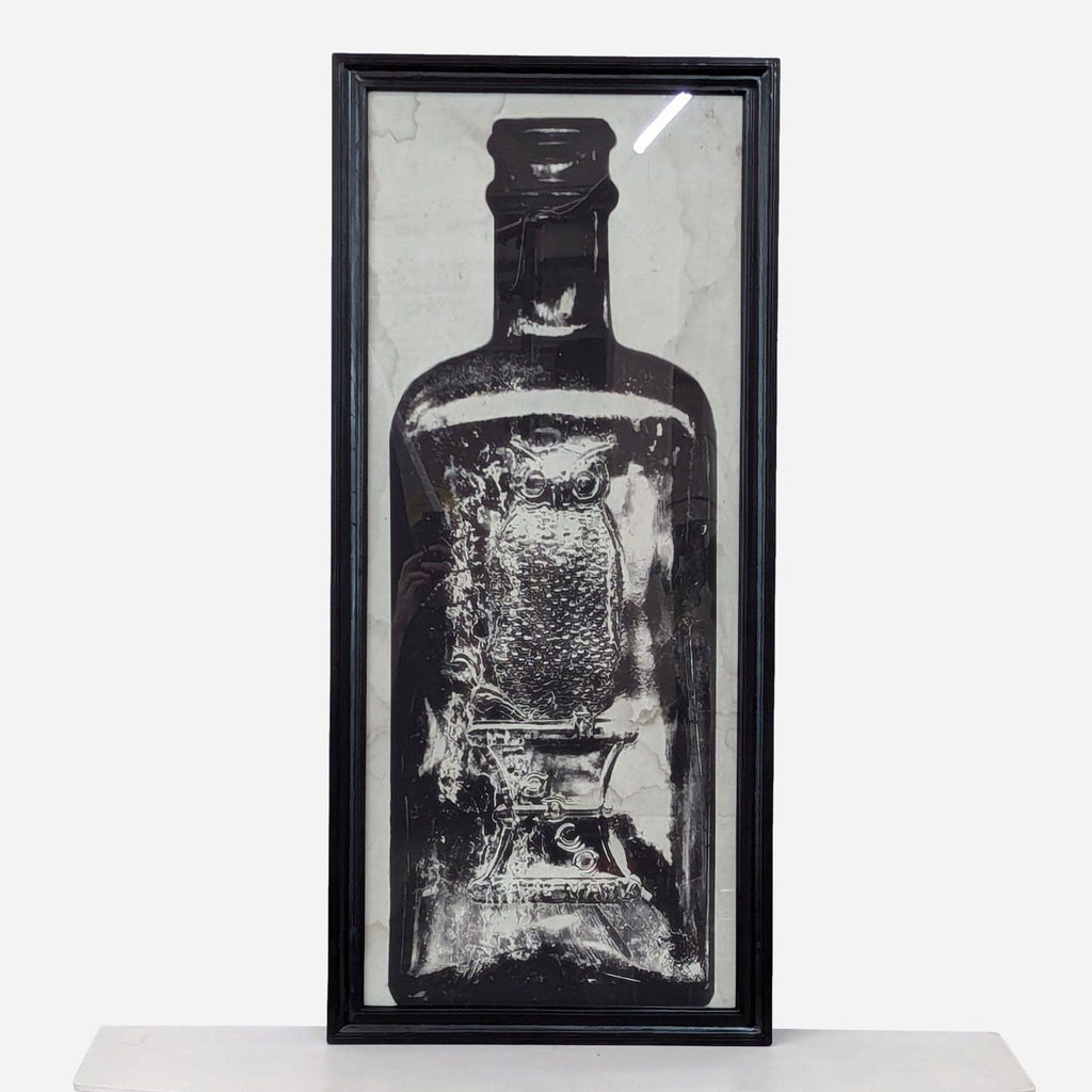 a black and white framed print of a bottle of alcohol.