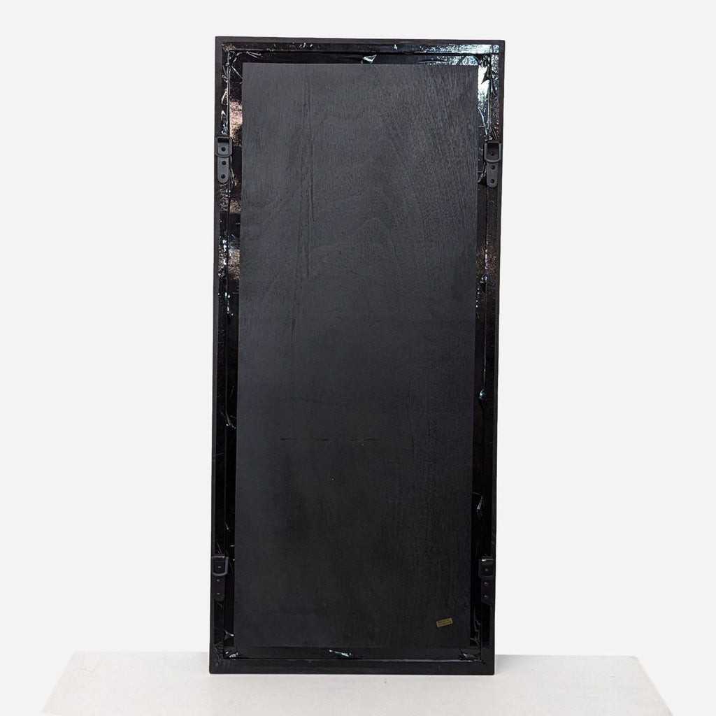 a large black lacquer mirror with a white background.