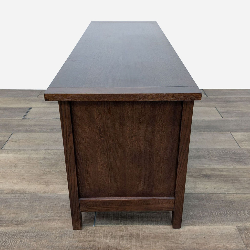 a dark walnut desk with a dark brown finish.