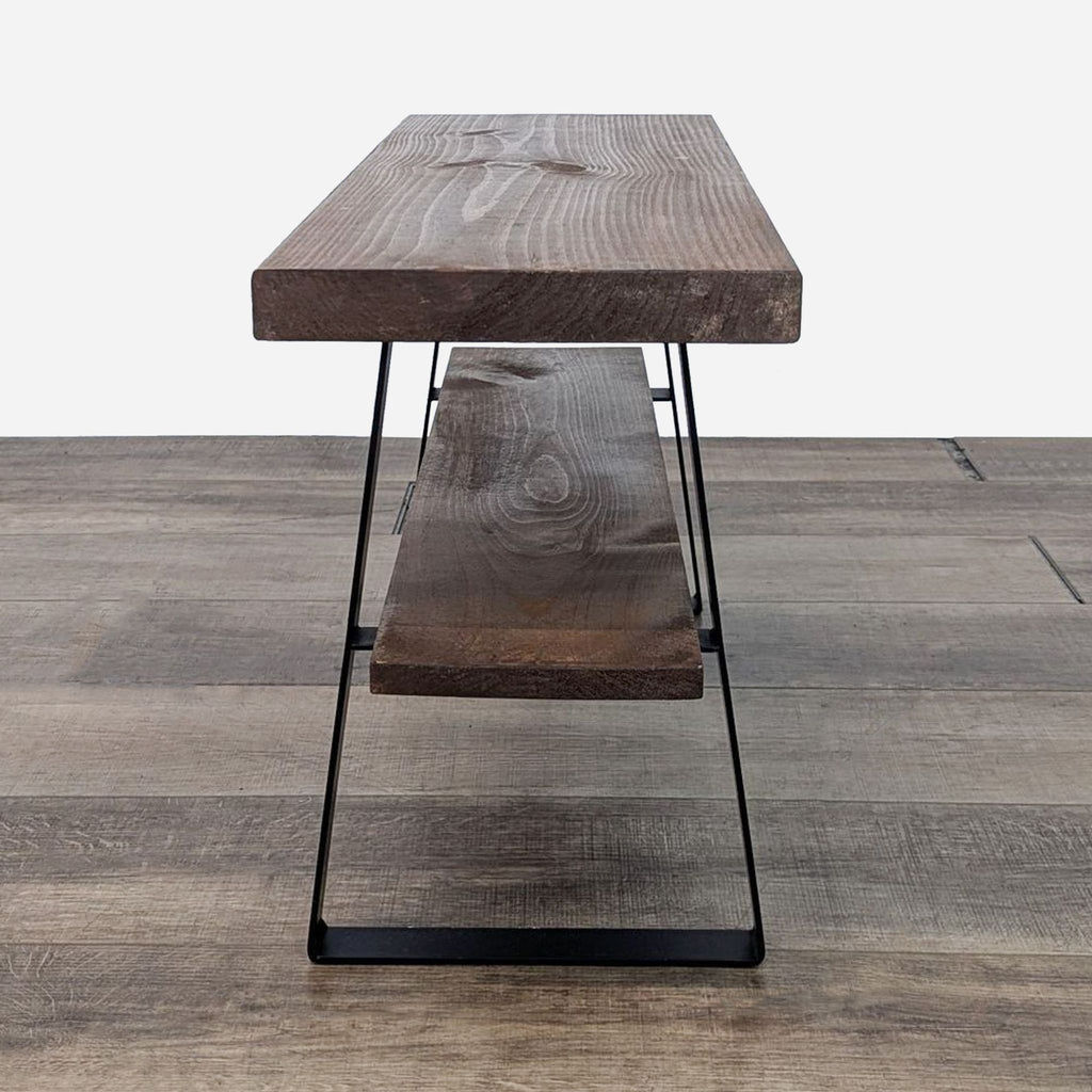 Side table by Reperch featuring a wooden design with black metal angled supports.
