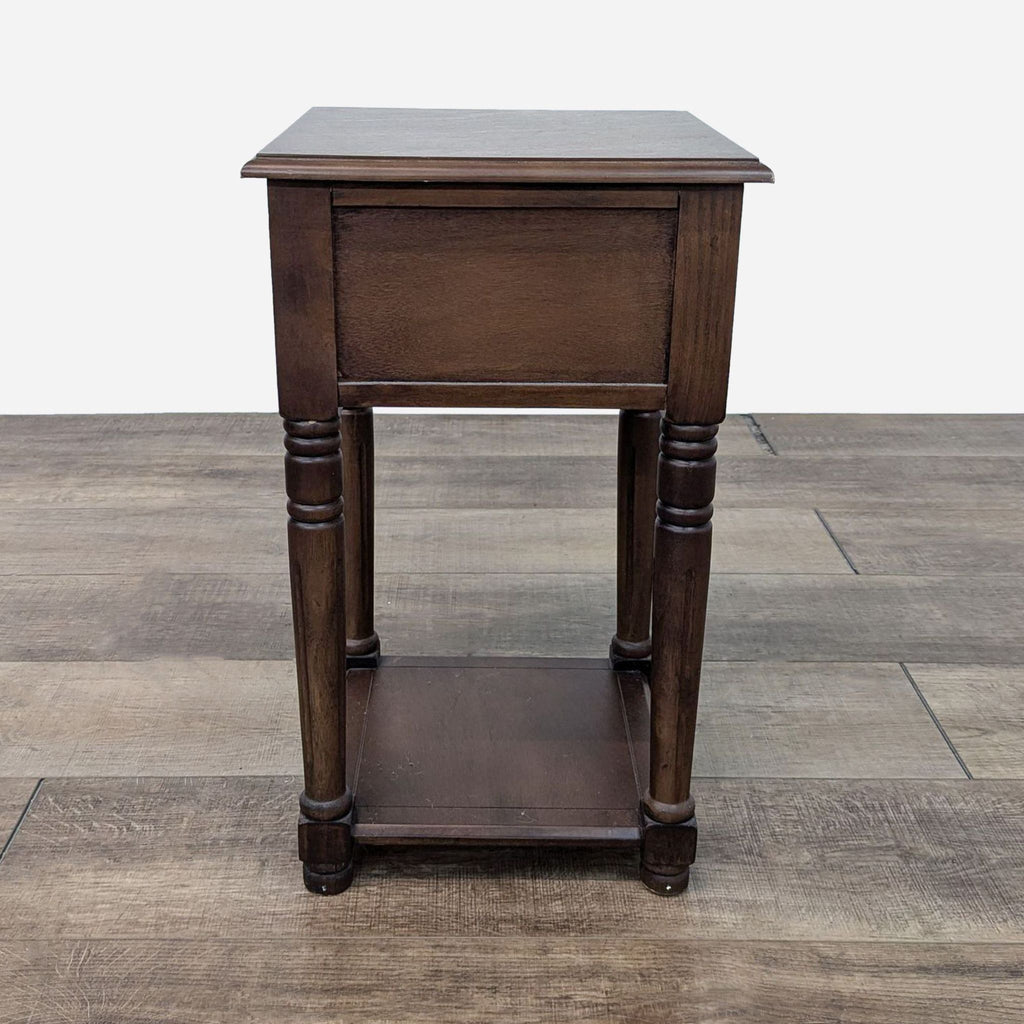 a dark wood end table with a shelf