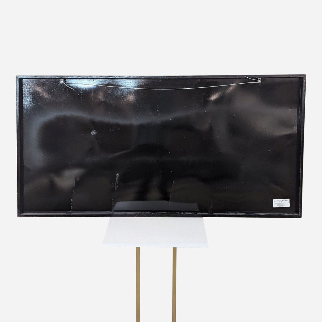 a black and white tv stand with a white lamp shade.