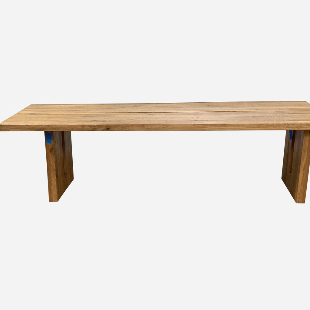 a long rectangular table with a wooden top.