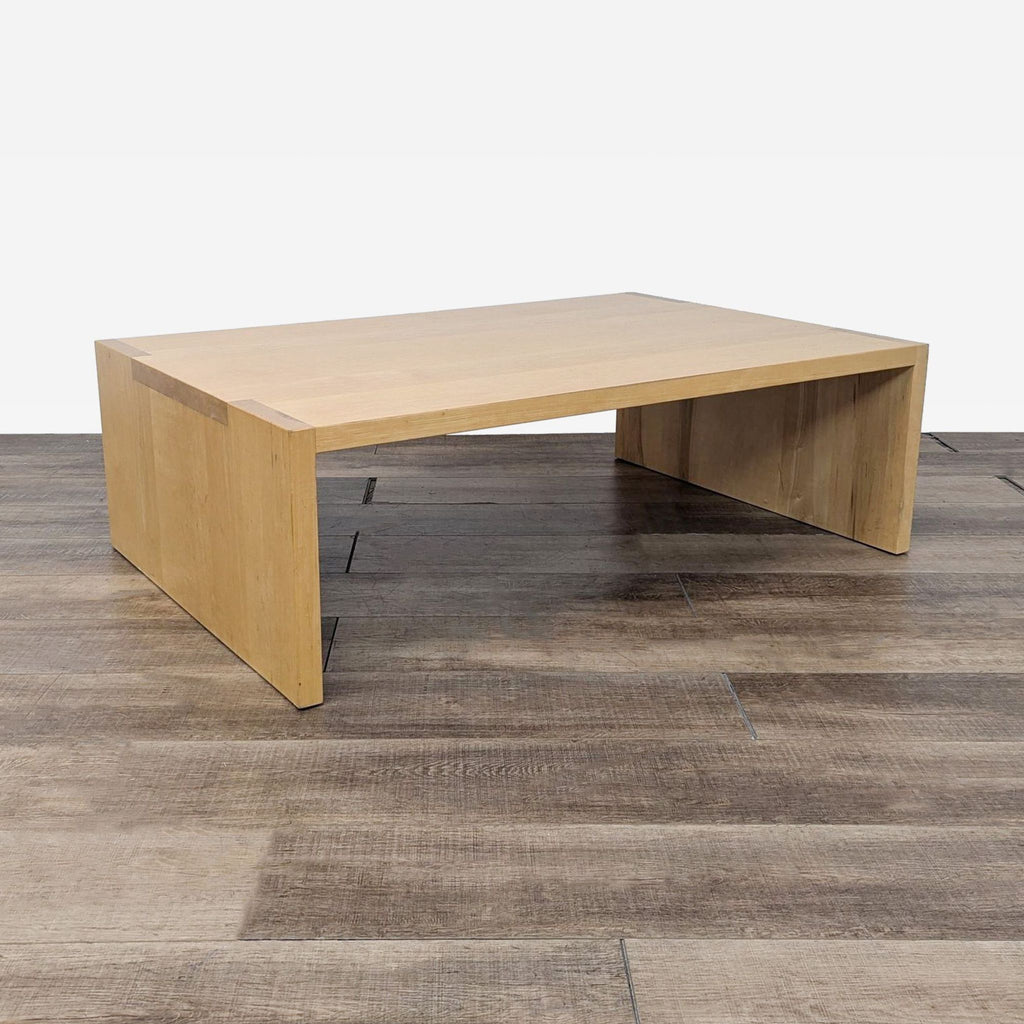 a modern coffee table with a solid wood top.