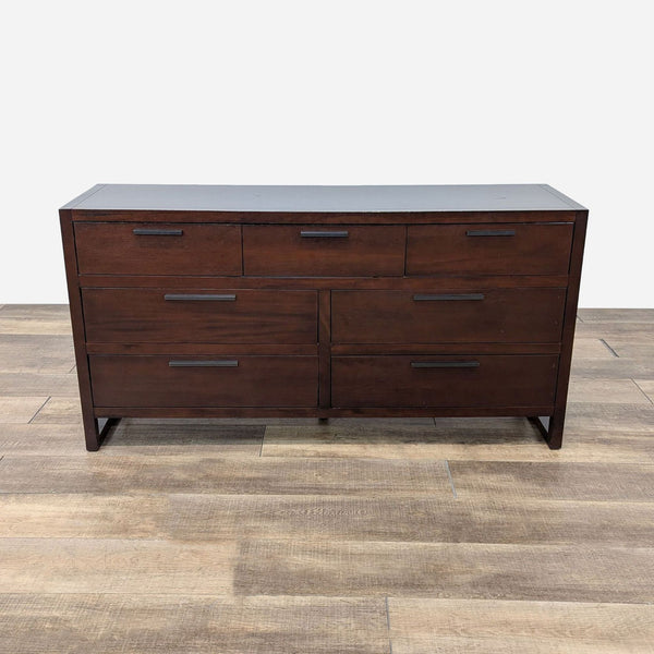 a large, dark wood dresser with two drawers.
