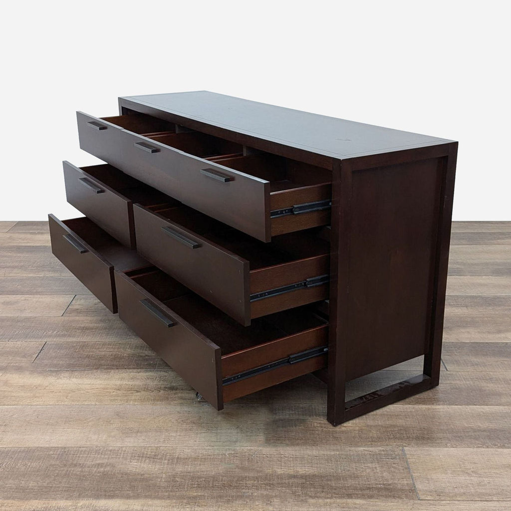 a large, dark brown, three - drawer chest with drawers.