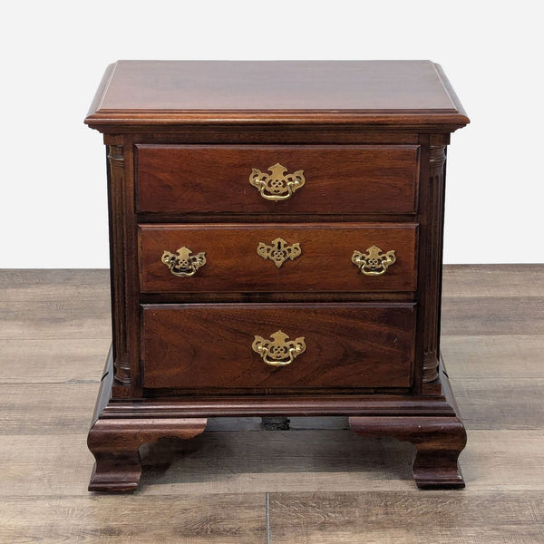 a mahogany side table with a drawer and two drawers.