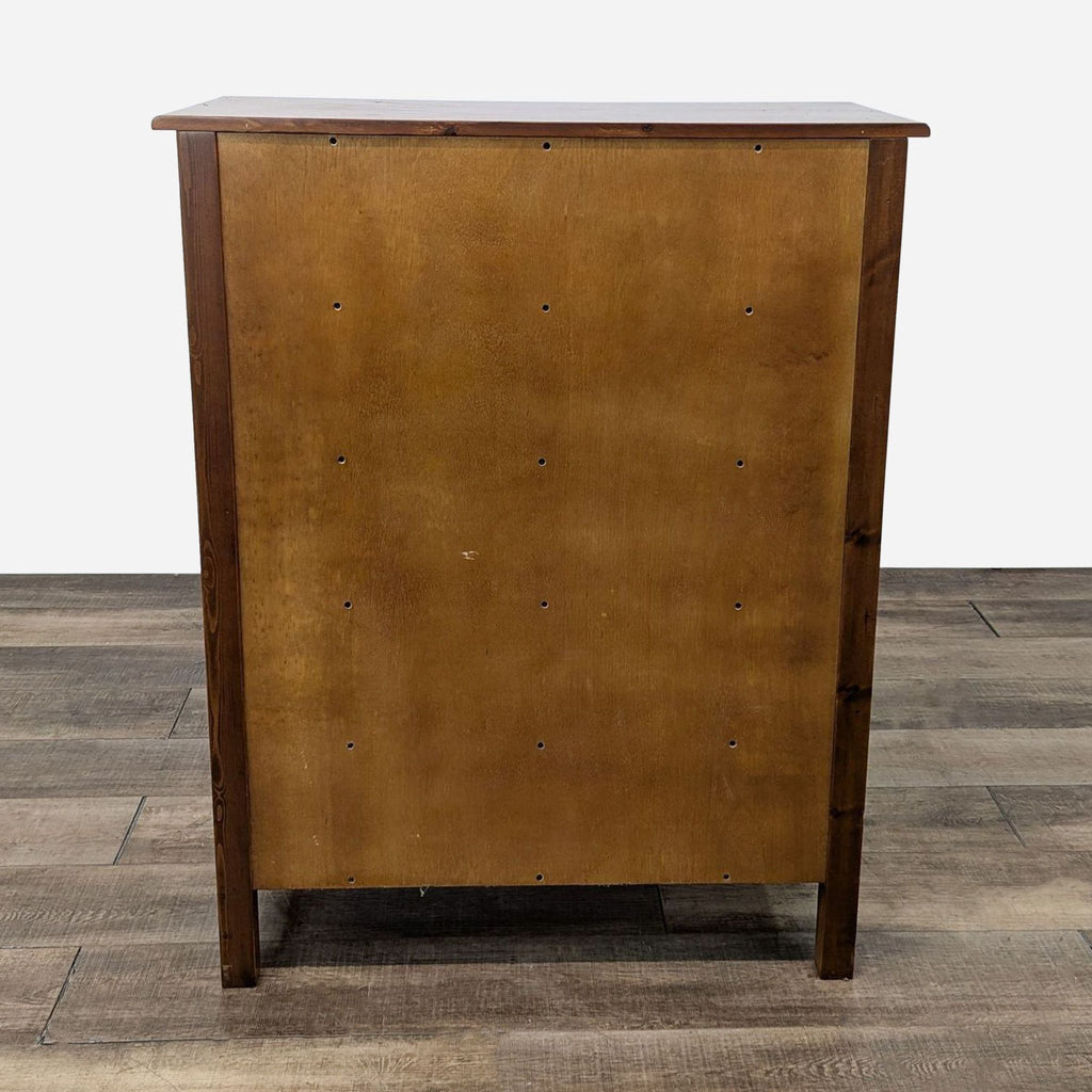 a vintage cabinet made of solid wood with a brass finish.