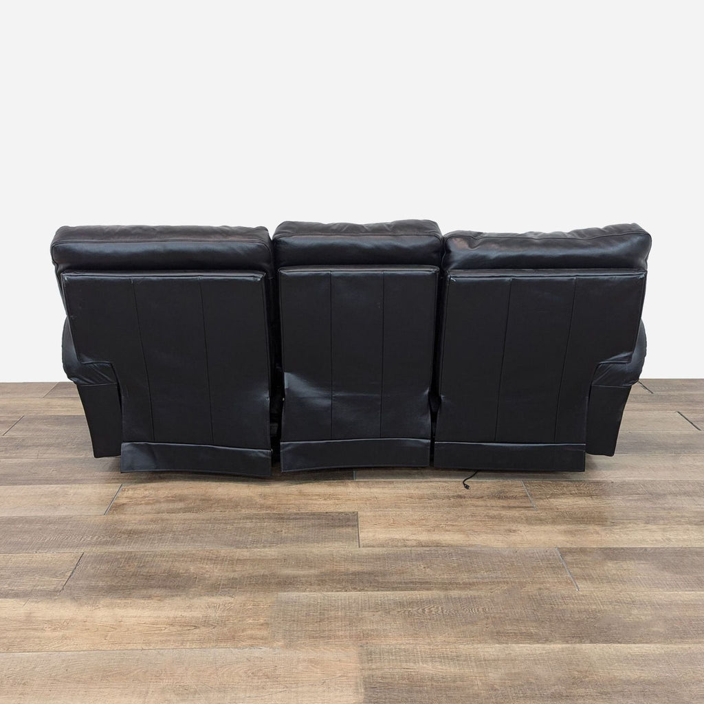 a set of four leather sofas in the style of [ unused0 ]