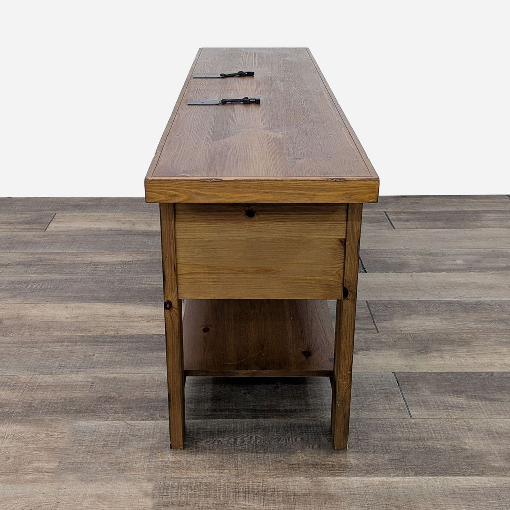 a large, solid wood desk with a drawer.