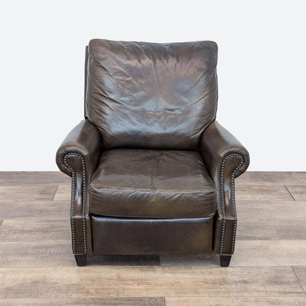 a leather recliner with a brown frame and a dark brown leather frame.