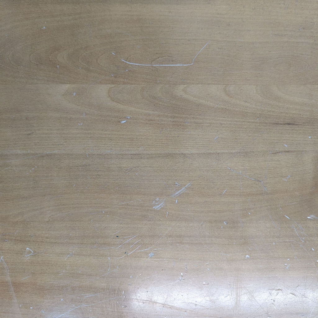 a close up of a wood floor with scratches.