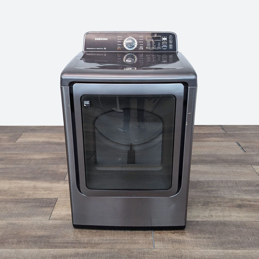 a dishwasher with a glass door.