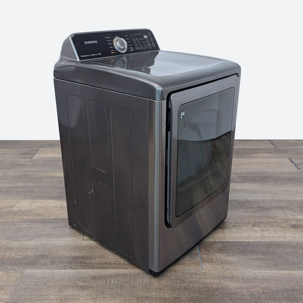 a washing machine on a wooden floor.