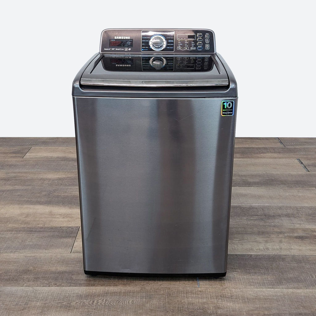 a stainless steel dishwasher on a wooden table.