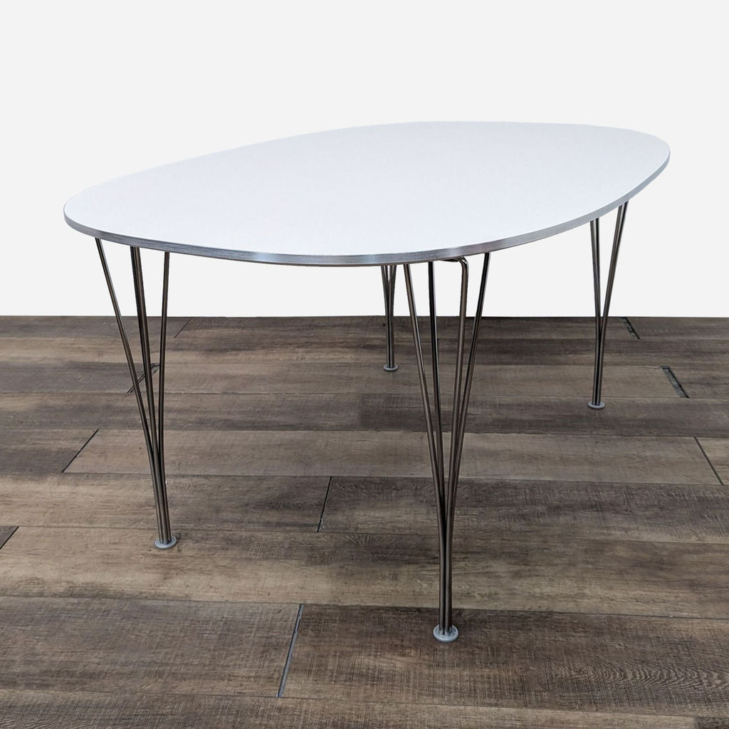 a round white table with a metal frame and a white metal base.