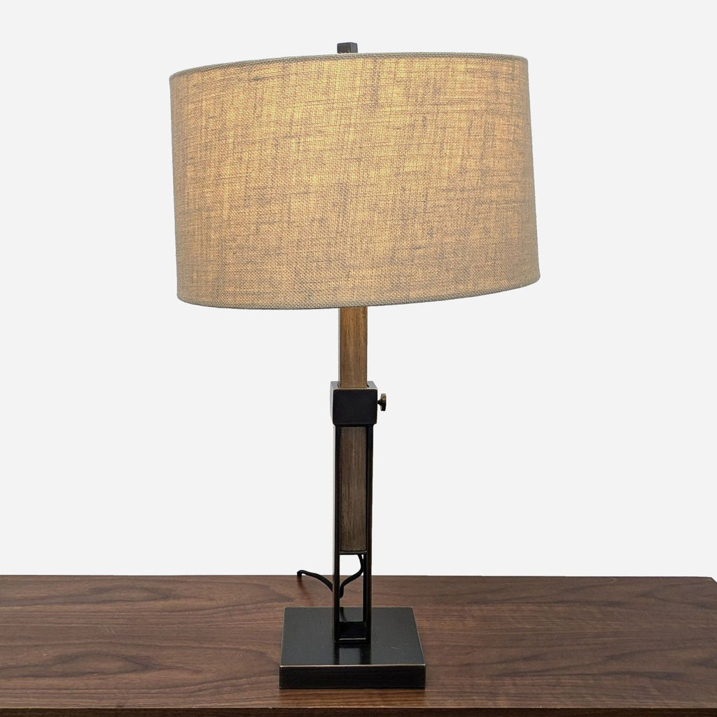 a table lamp with a beige shade.