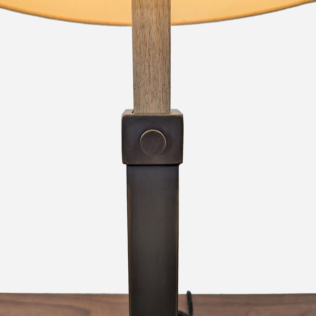 a wooden table with a lamp on top 