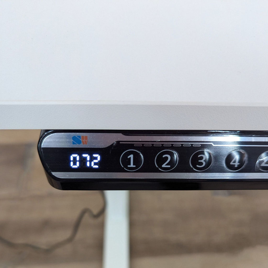 a close up of a clock on a desk